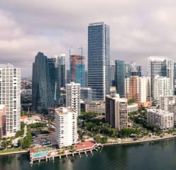 An aerial view of downtown miami. Skyscrapers are seen near the city waterfront.
