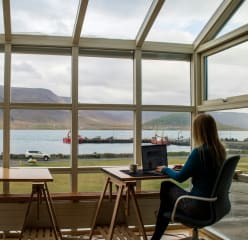 woman working remotely with a view