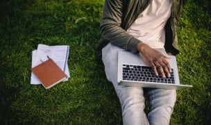 Person working outside on laptop