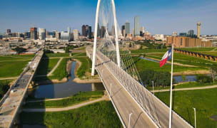 Dallas skyline, bridge, and Texas state flag