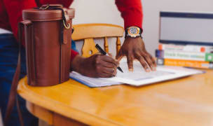 a man signs documents