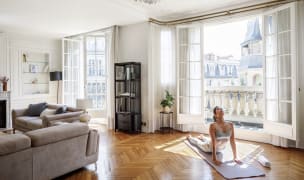 Woman doing yoga in her Paris Blueground apartment