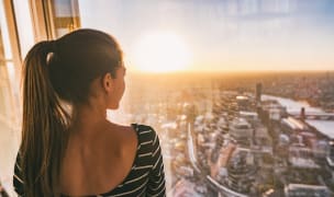 woman looks out at skyline