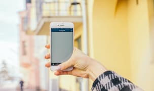 A woman uses her smartphone outdoors