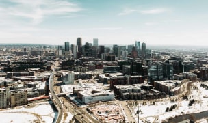 An aerial shot of downtown denver at midday.