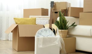 a pile of boxes in a new home