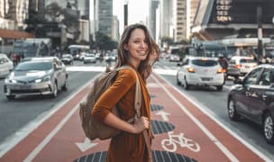 a woman crosses the street