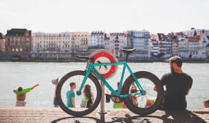 people lounging by the river in basel