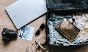 a packed suitcase with a few items to add