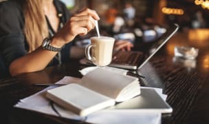 A barista preparing an espresso in a boston coffee shop.