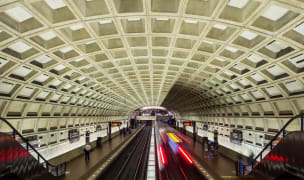 public transport in DC inside a metrorail station with a train passing