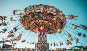 nyc street fair carnival swing ride on a sunny day