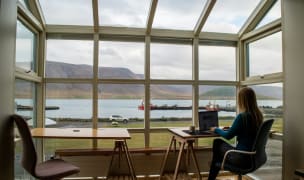 woman working remotely with a view