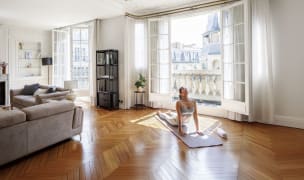 woman doing yoga in paris apartment