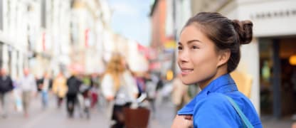 Woman on a European street looking around