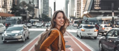 a woman crosses the street
