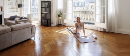 woman doing yoga in paris apartment