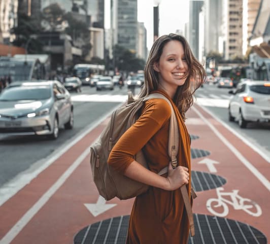 a woman crosses the street