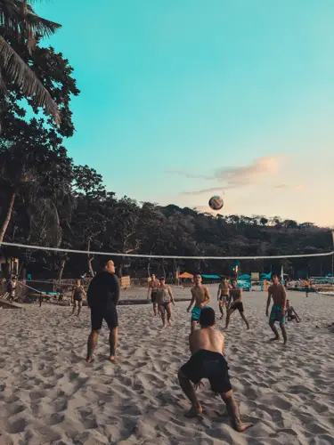 Playing Spikeball On The Beach Is A Fun Activity To Do Under The Sun. 2 Spikeball On The Beach Playing Spikeball At The Beach