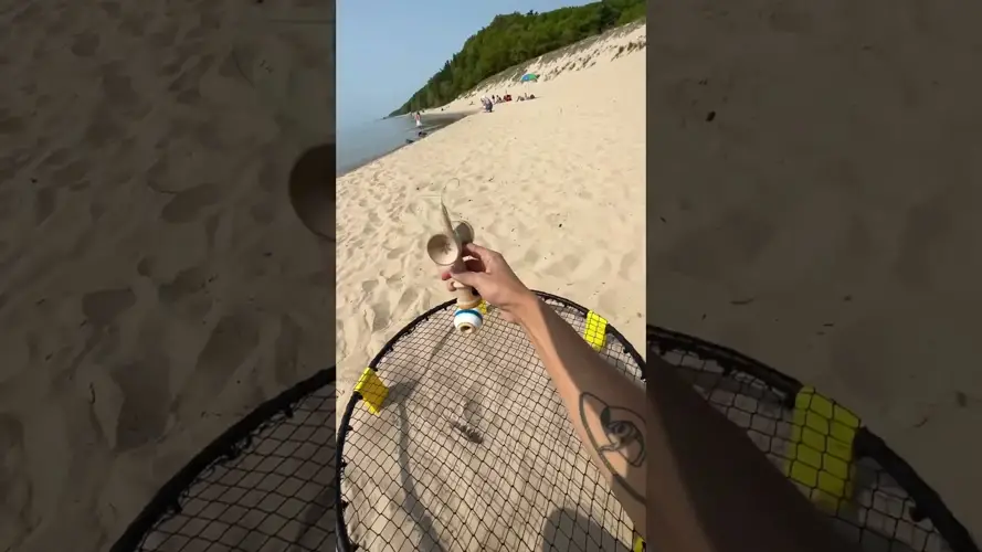 Playing Spikeball On The Beach Is A Fun Activity To Do Under The Sun. 3 Spikeball On The Beach Playing Spikeball At The Beach