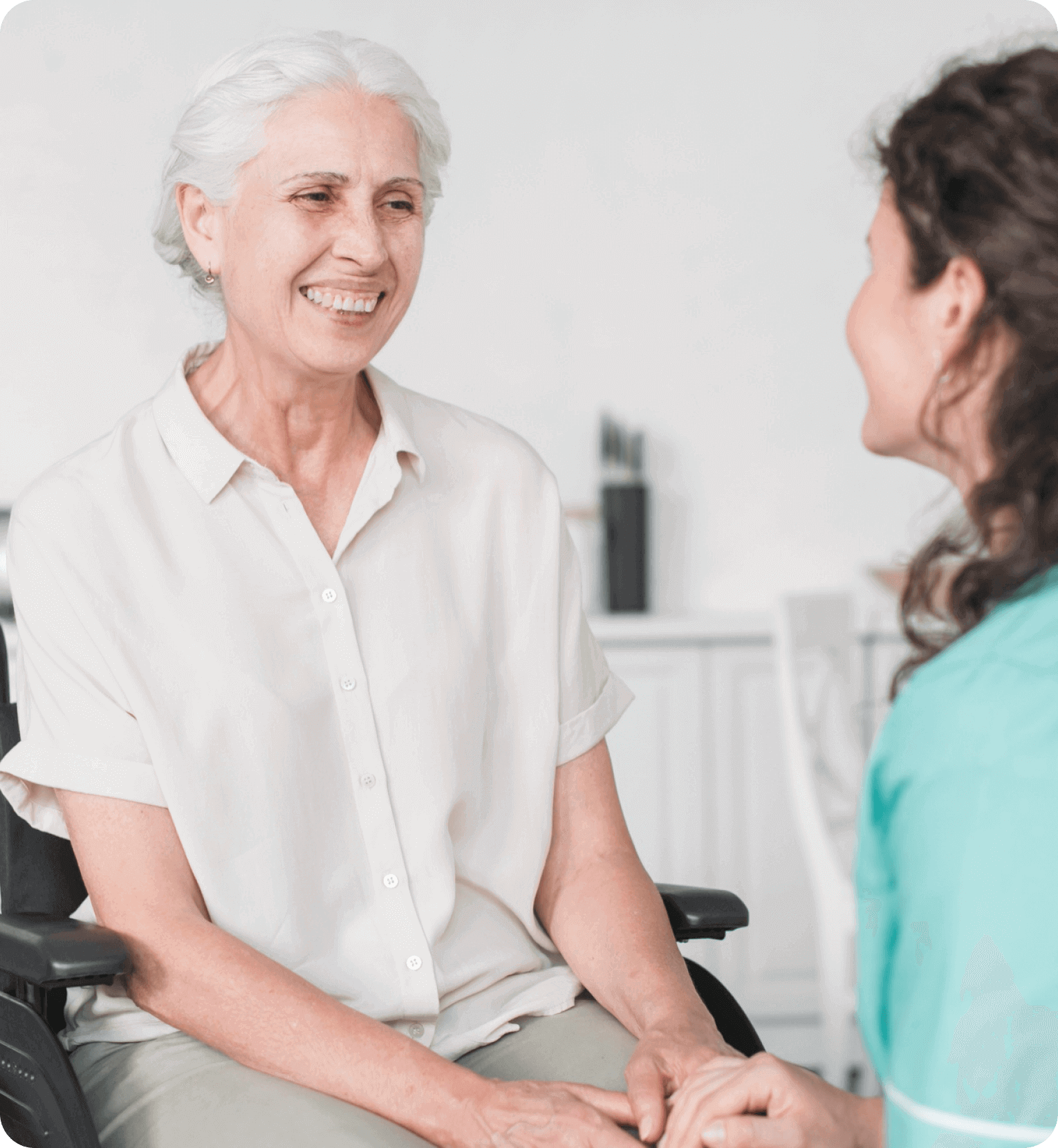 a young lady talking to an older woman