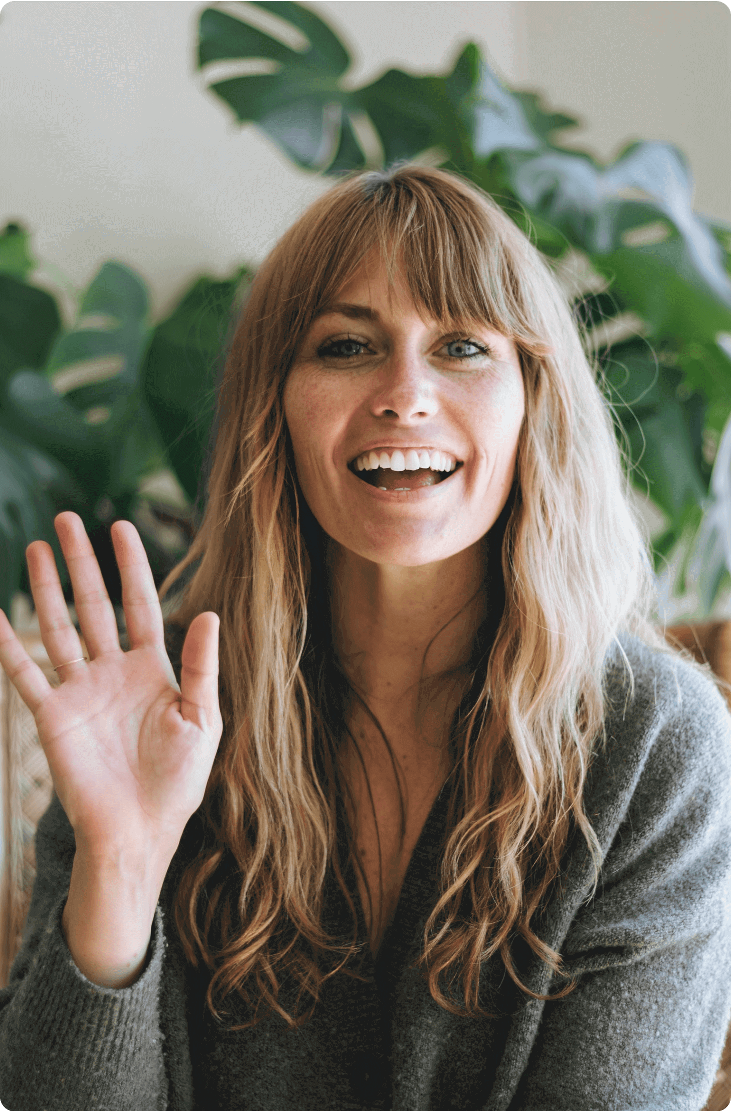 a woman waving her hand