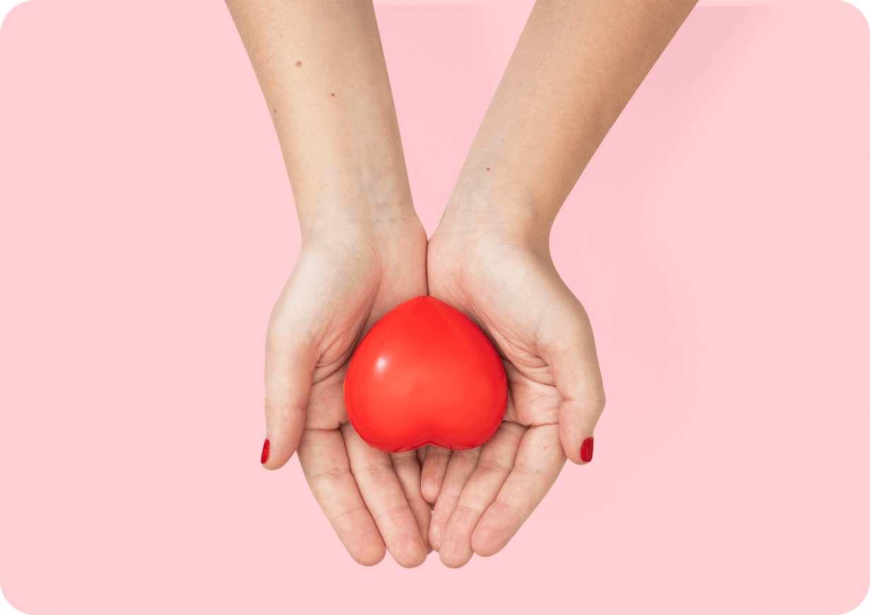two hands holding a heart shaped object