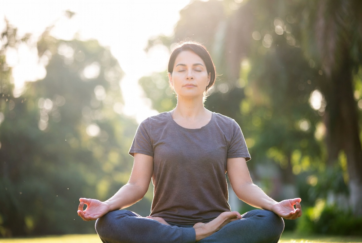 A girl peacefully meditating in nature