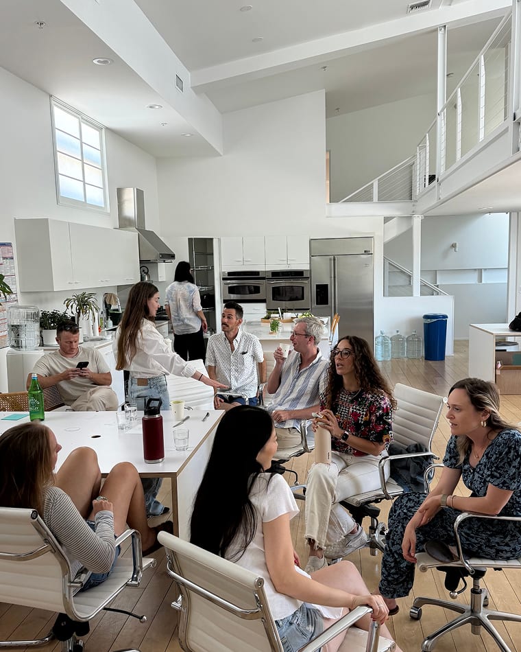Seed team members meeting together in a bright, open office