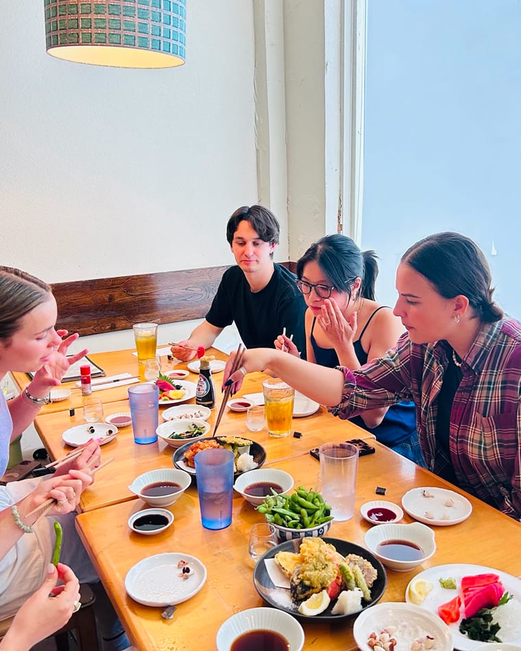 Seed team members sharing a meal together indoors