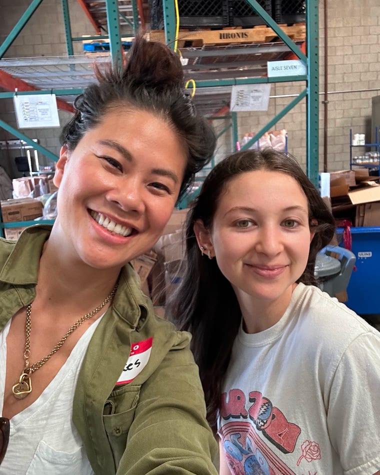 Two Seed team members smiling together at the warehouse