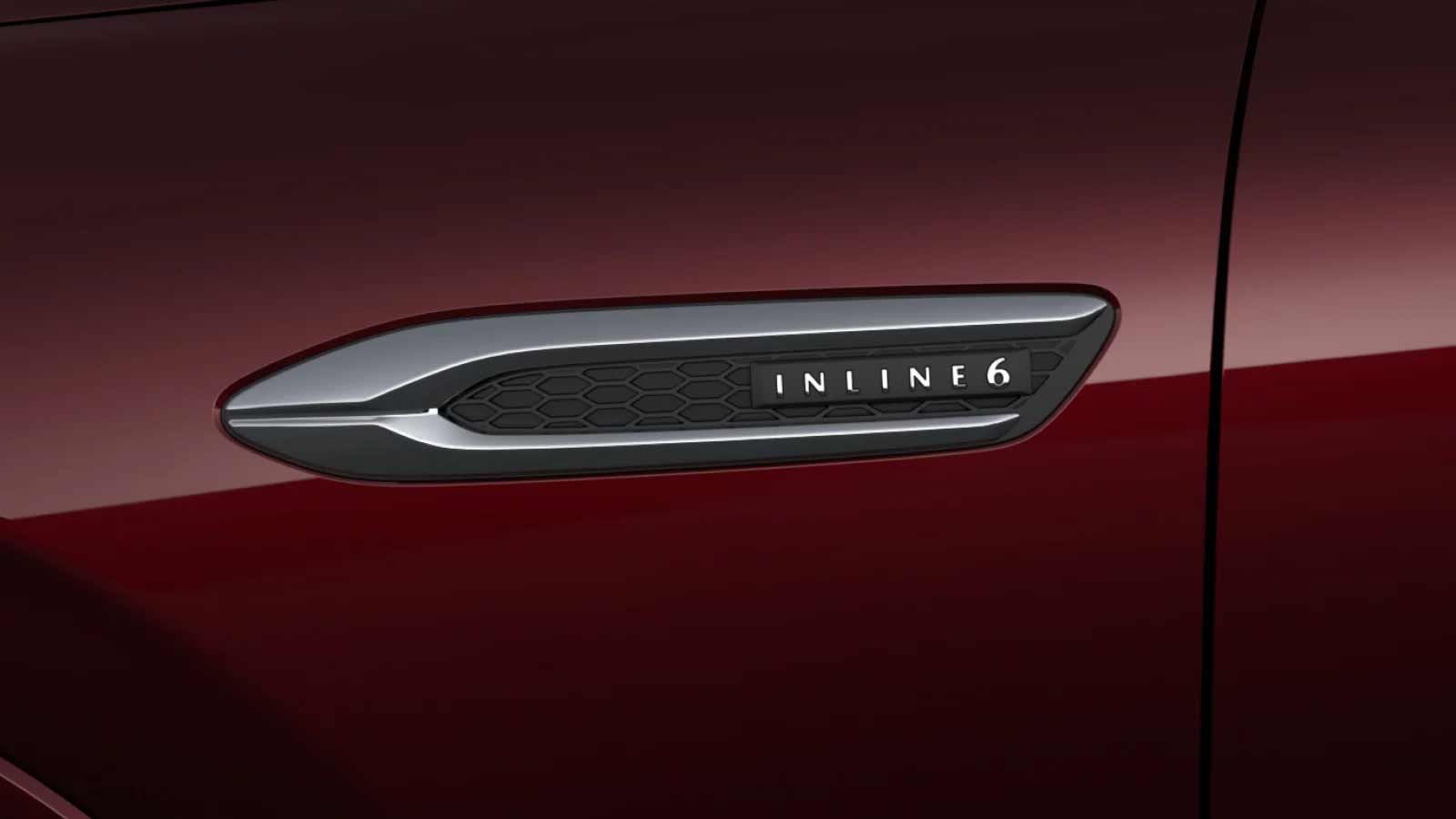 Close-up of a side Inline 6 grille on an Artisan Red Mazda CX-80 7-seat hybrid SUV