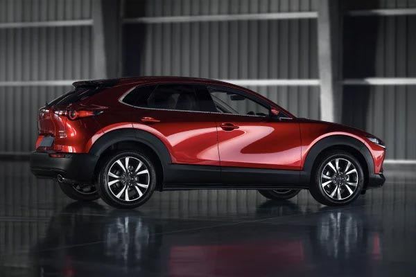 Side view of a Soul Red Mazda CX-30 SUV