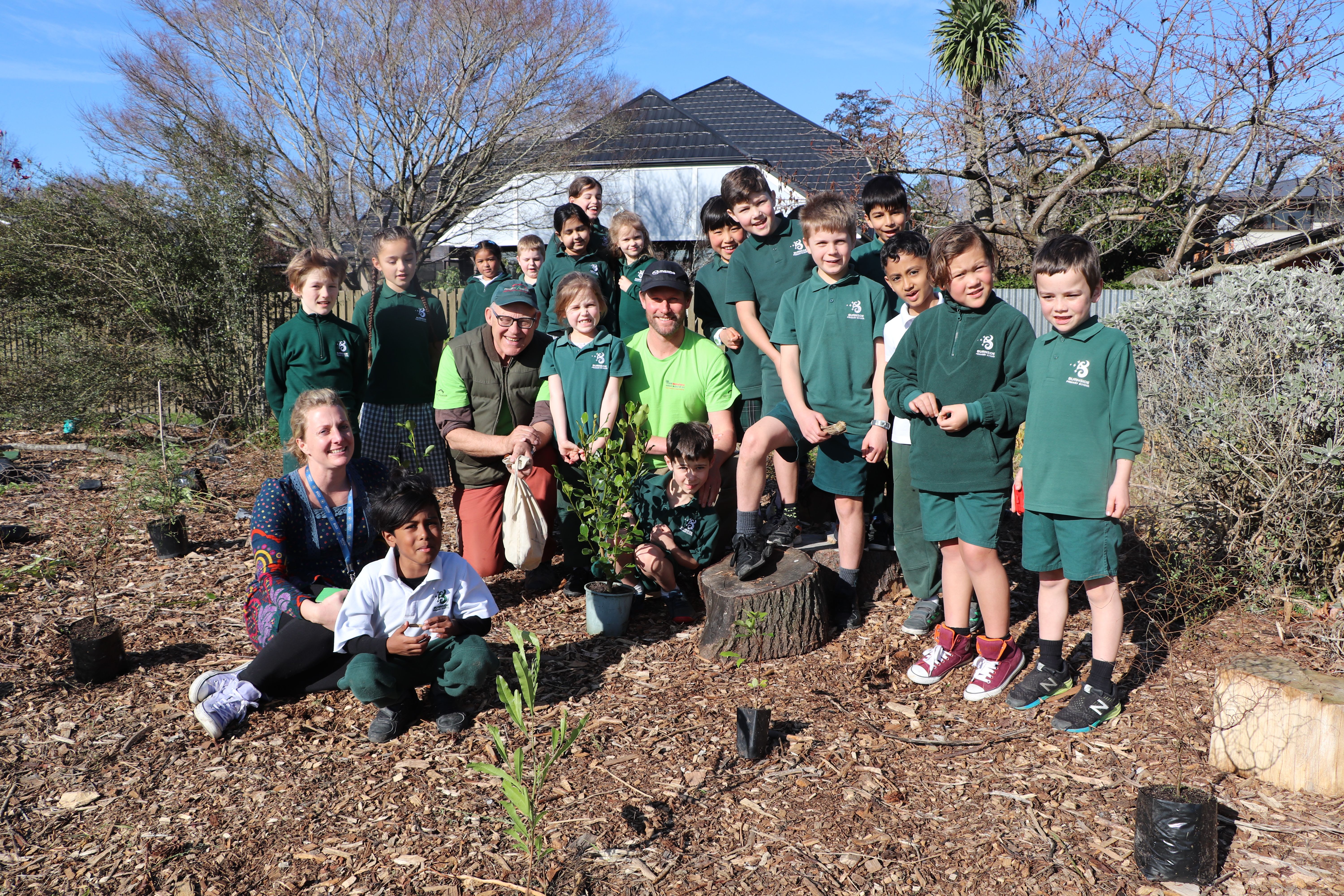 Teachers and students post for a photo for the TREEmendous education programme