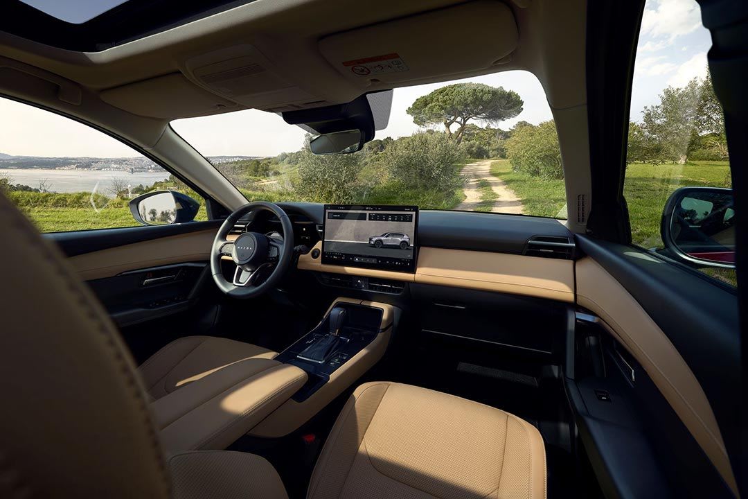 Interior of the all-new Mazda CX-5 SUV with beige trim and a large central touchscreen