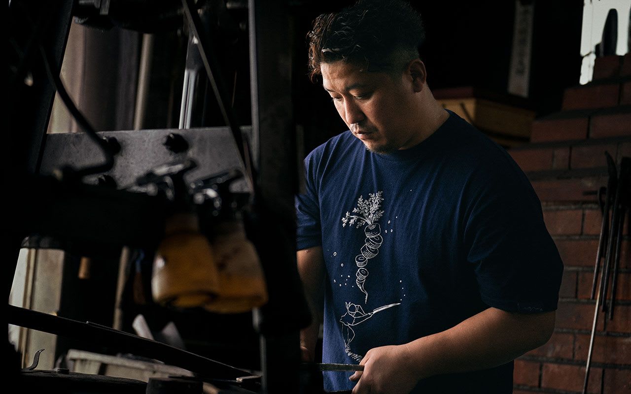Japanese knife maker at his workshop