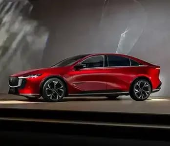 Side view of a fully electric red Mazda 6e on display