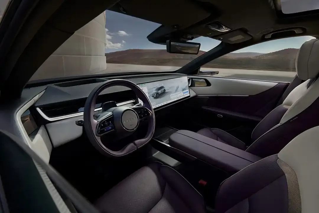 Three quarter view of the interior and dashboard of a Mazda CX-6e electric SUV