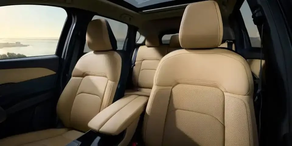 Looking back at the beige leather front seats of the Mazda CX-5 SUV