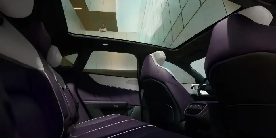 Looking up through the panoramic sunroof of the all-electric Mazda CX-6e SUV