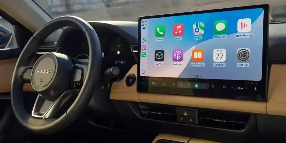 Centre touchscreen of a Mazda CX-5 SUV that is connected to an Apple phone via Apple CarPlat