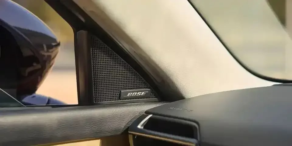 Close up of a BOSE® premium HiFi speaker in the front dash of a Mazda CX-5 SUV