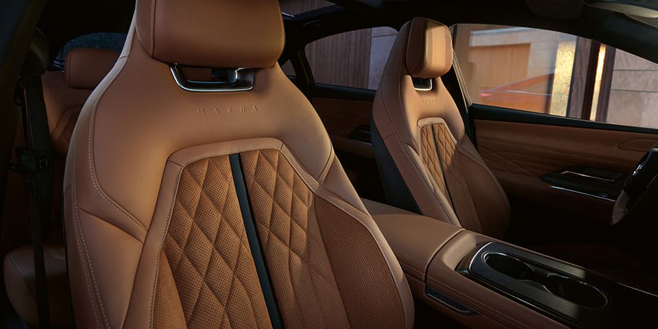 Tan Nappa leather front seats of the all-electric Mazda 6e hatchback
