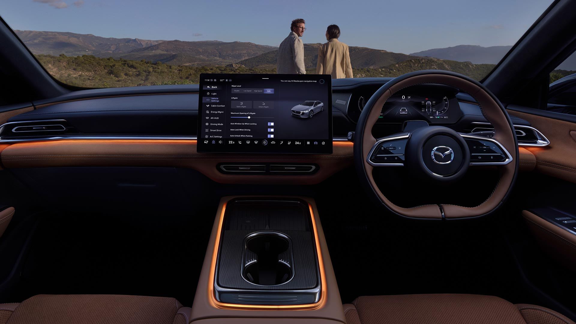 Looking at the cockpit and brown leather seats of an all-electric Mazda 6e hatchback 