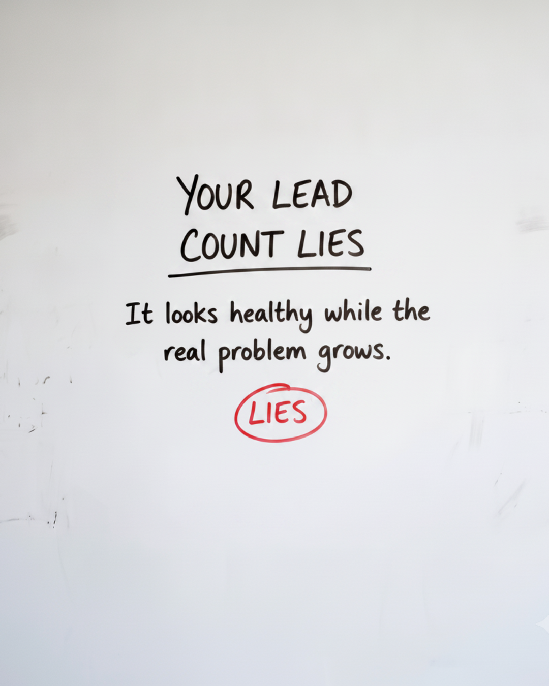 Whiteboard with the words YOUR LEAD COUNT LIES written in black marker, with the word LIES circled in red