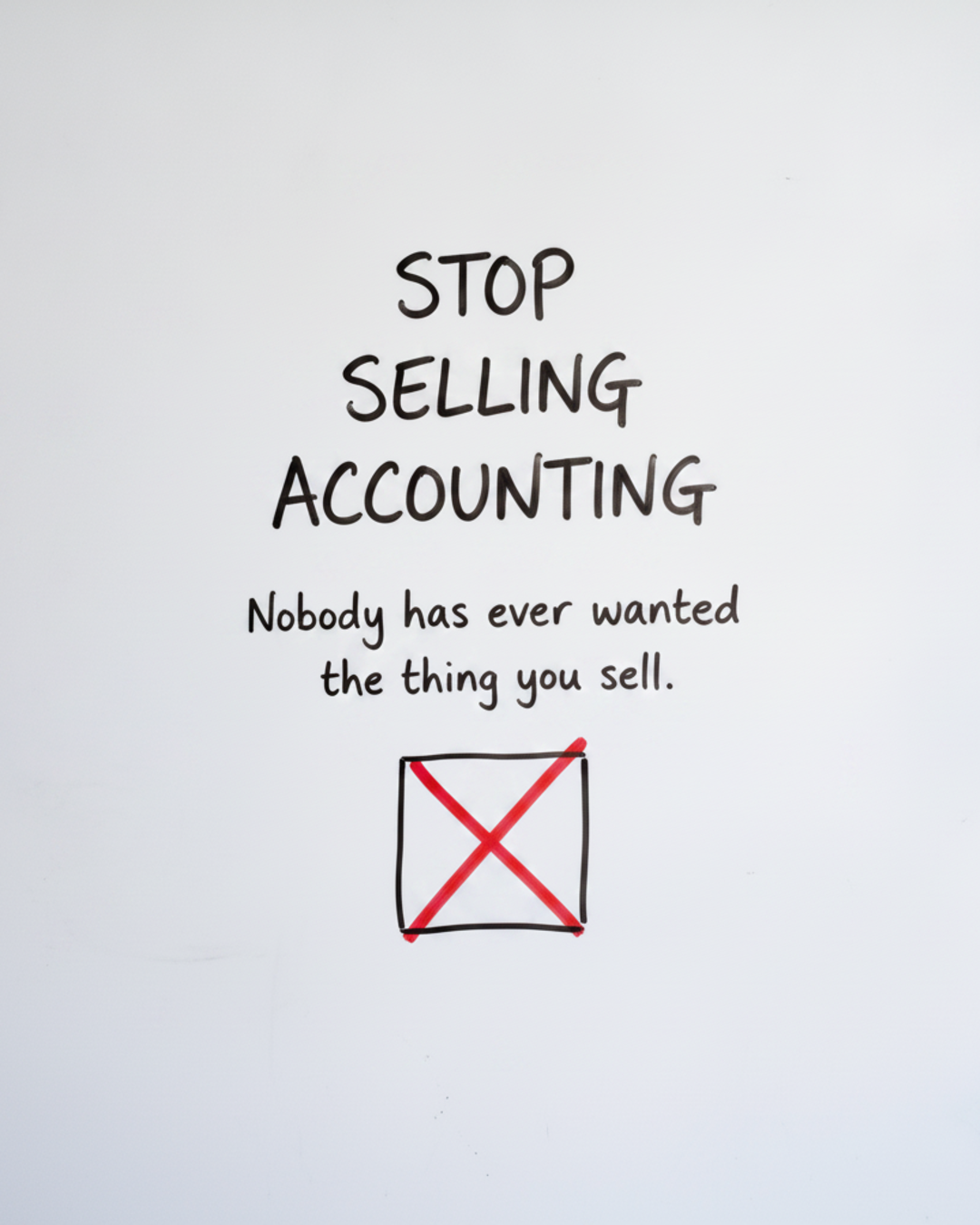 Whiteboard with the words Stop selling accounting written in black marker above a small box with a red cross through it