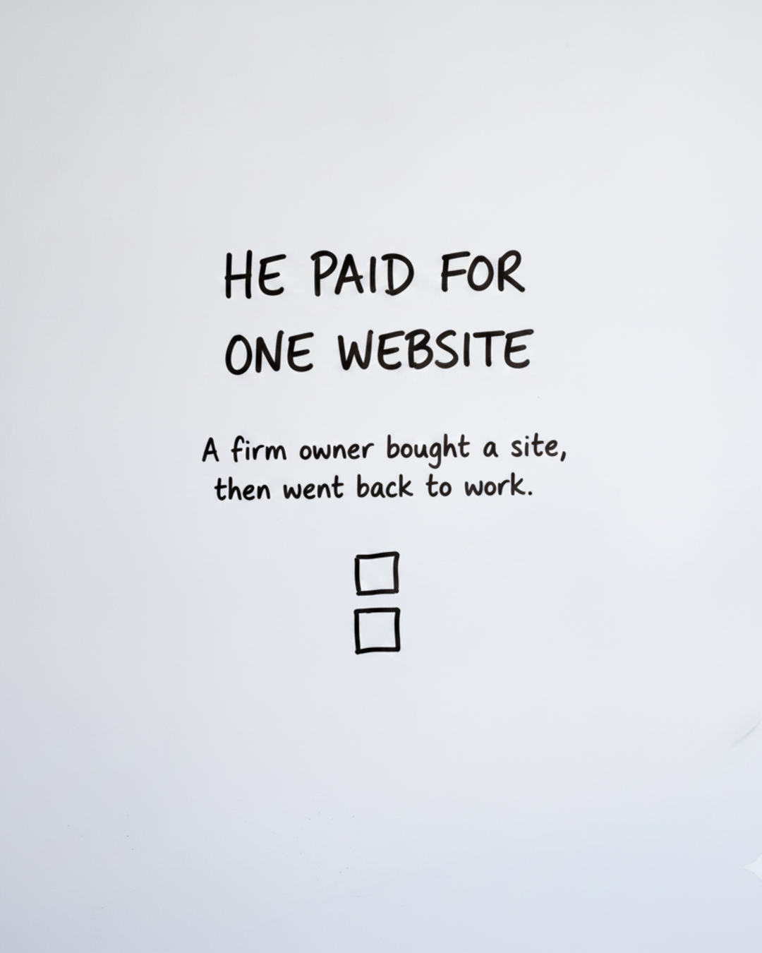 Whiteboard with the words HE PAID FOR ONE WEBSITE in black marker above two hand drawn boxes stacked vertically