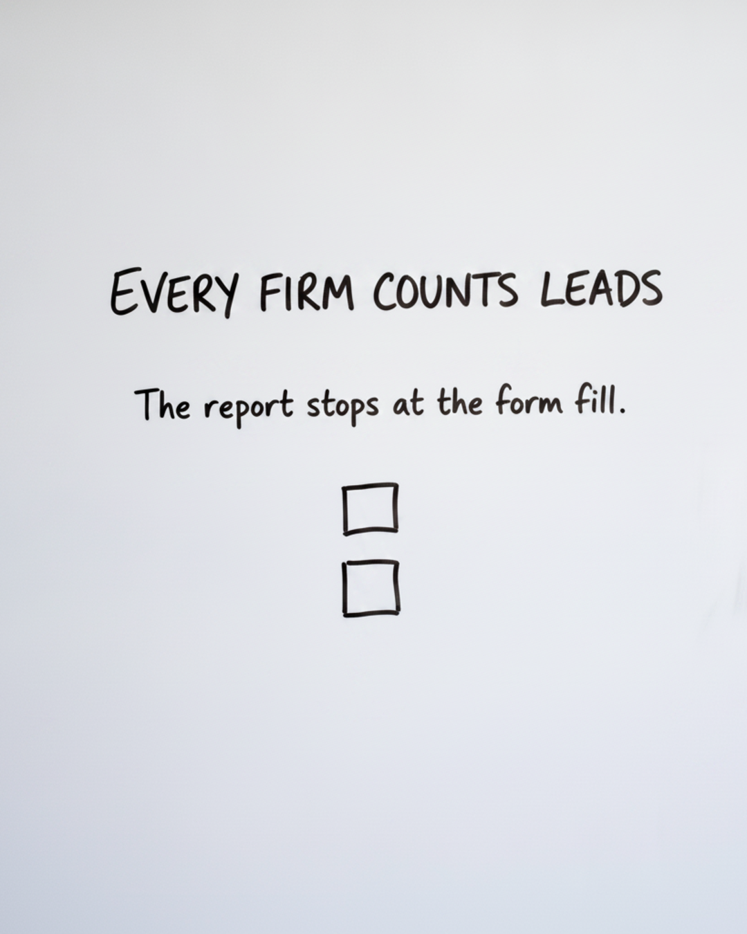 Whiteboard with the words Every firm counts leads written in black marker, above two small hand-drawn boxes stacked vertically