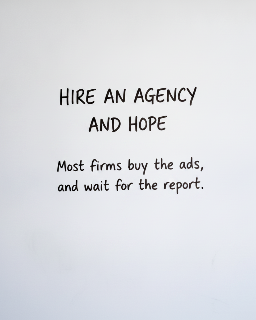Whiteboard with the words Hire an agency and hope written in black marker