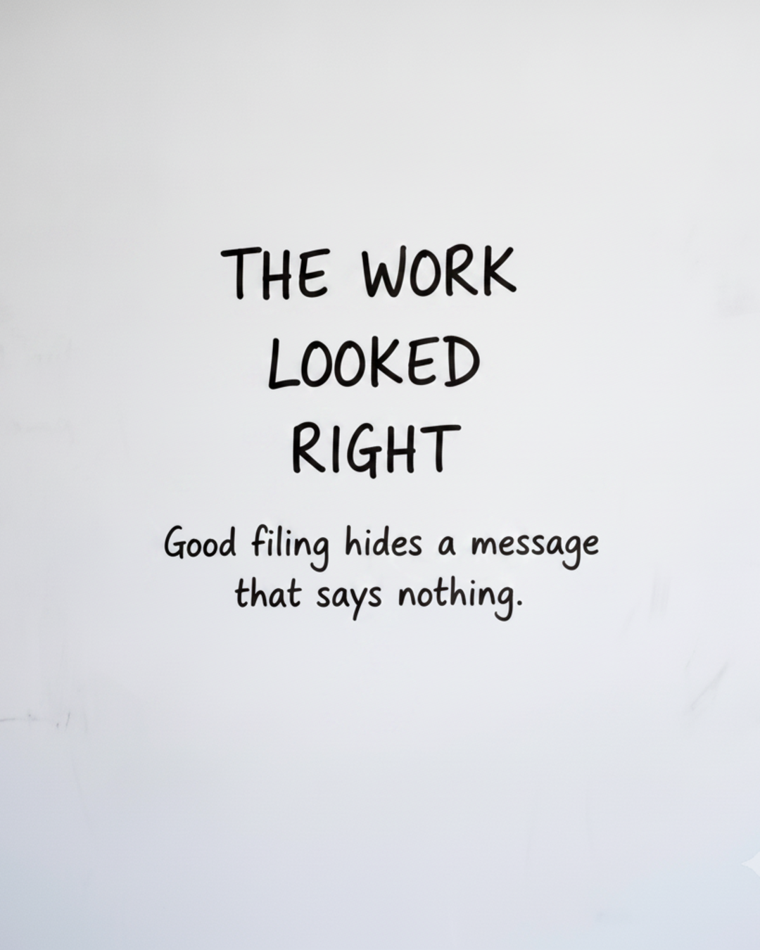 Whiteboard with the words The work looked right written in black marker, text only